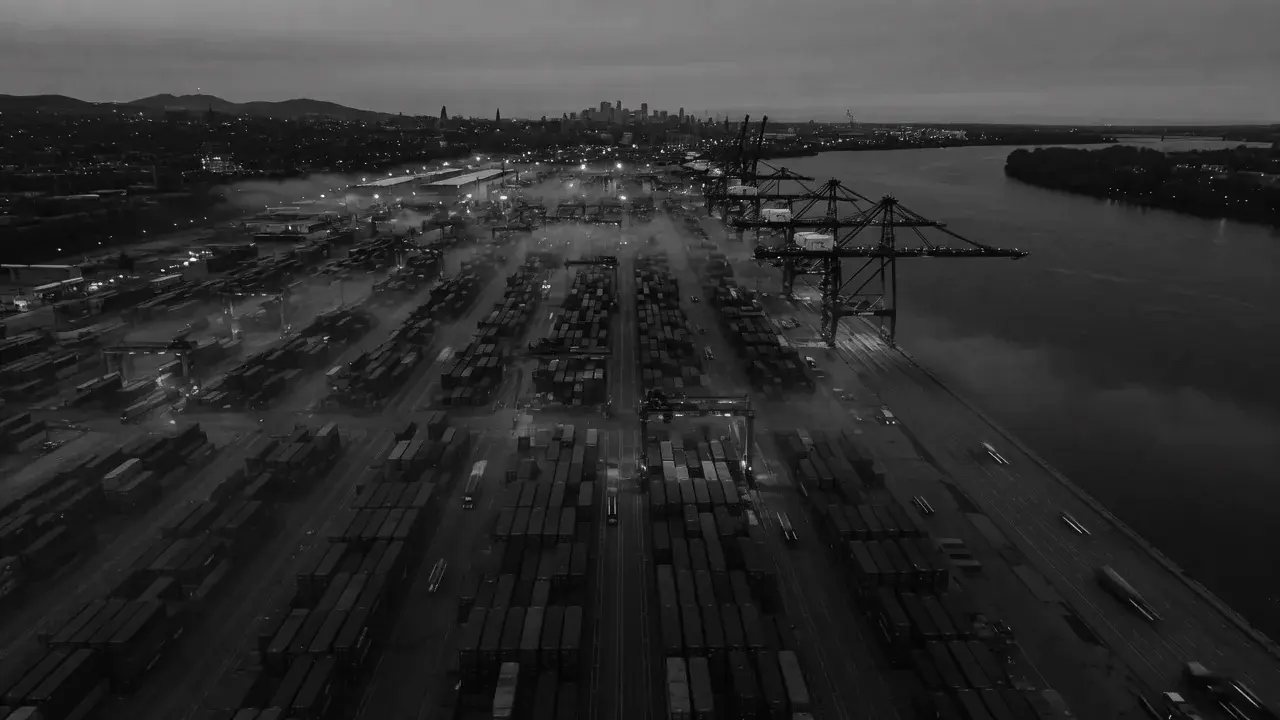 Aerial view of an intermodal container terminal at dusk.